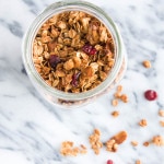 Holiday Gingerbread Granola is spiced with cinnamon, ginger, cloves, and molasses - make some to have on hand for Christmas guests!