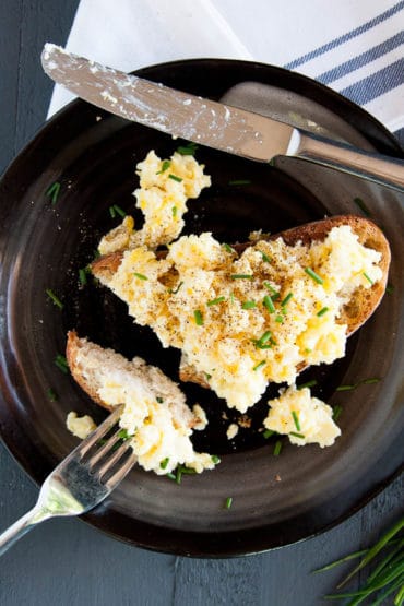 Fluffy scrambled eggs are made with only two ingredients and are a GAME-CHANGER! Try them for breakfast this weekend!