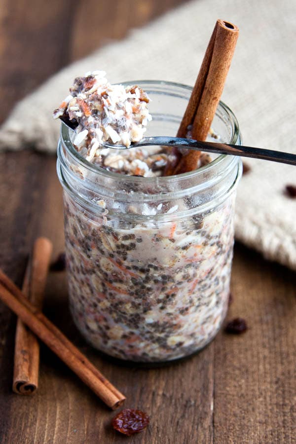 Shredded carrots, plump raisins, sweet spices combine with oatmeal and chia seeds to make Carrot Cake Overnight Oats!