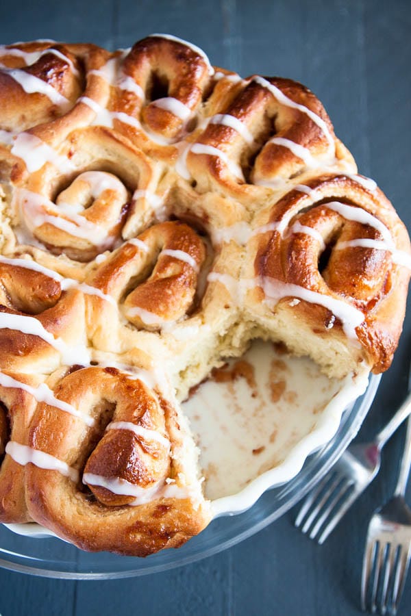 Strawberry Sticky Buns are like soft fluffy pillows rolled together with gooey strawberry jam, and drizzled with a tangy lemon glaze. 