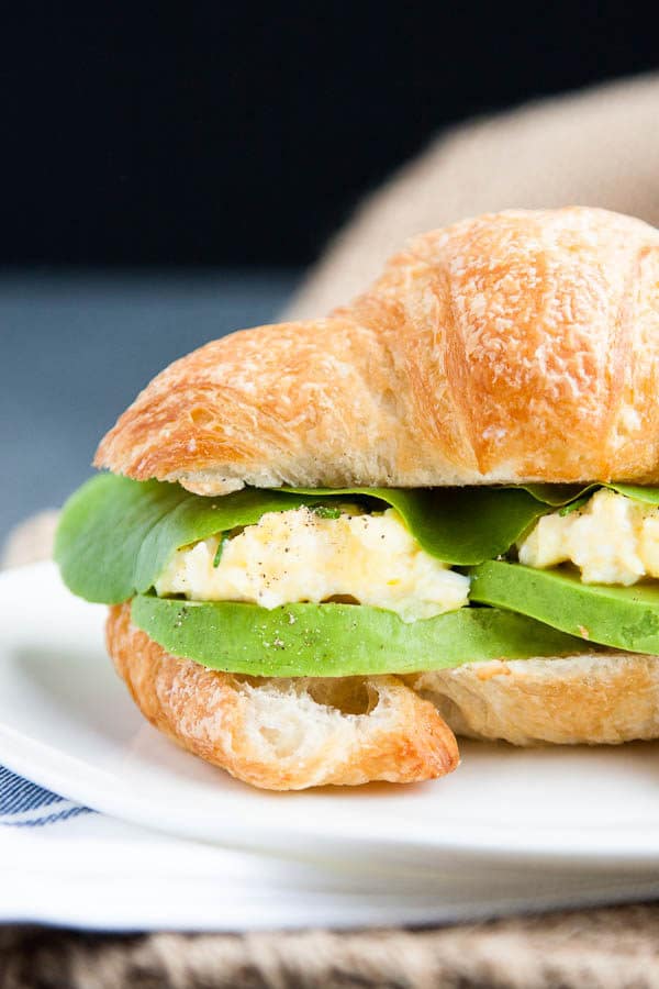 Take a flaky croissant, fluffy scrambled eggs, and slices of rich avocado, pair it with a few leaves of butter lettuce (I've used the lettuce from our garden!) and you have one helluva breakfast sandwich.