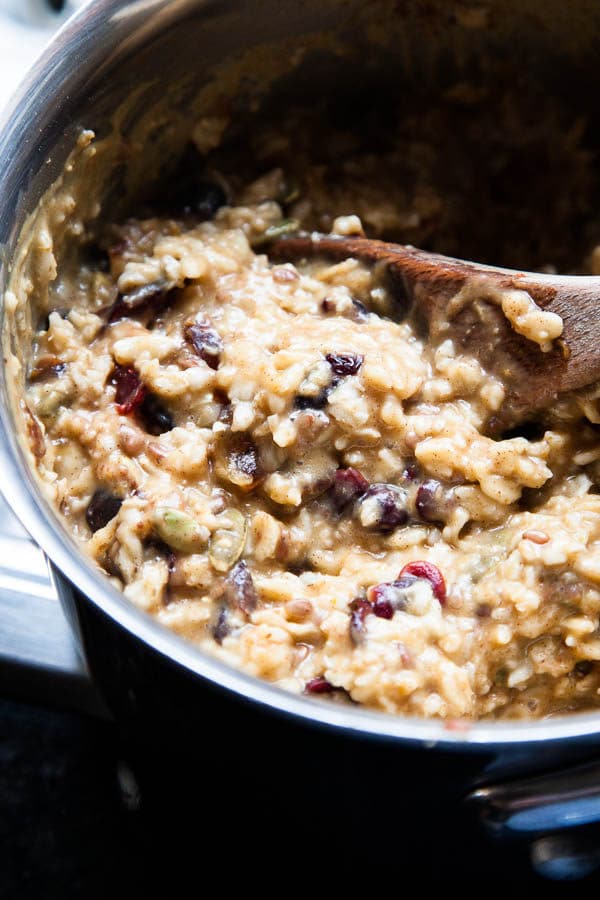 This bubbling pot of warm, creamy Stovetop Oatmeal is an homage to the autumn season with pumpkin puree, dried cranberries, pecans, and warming spices.