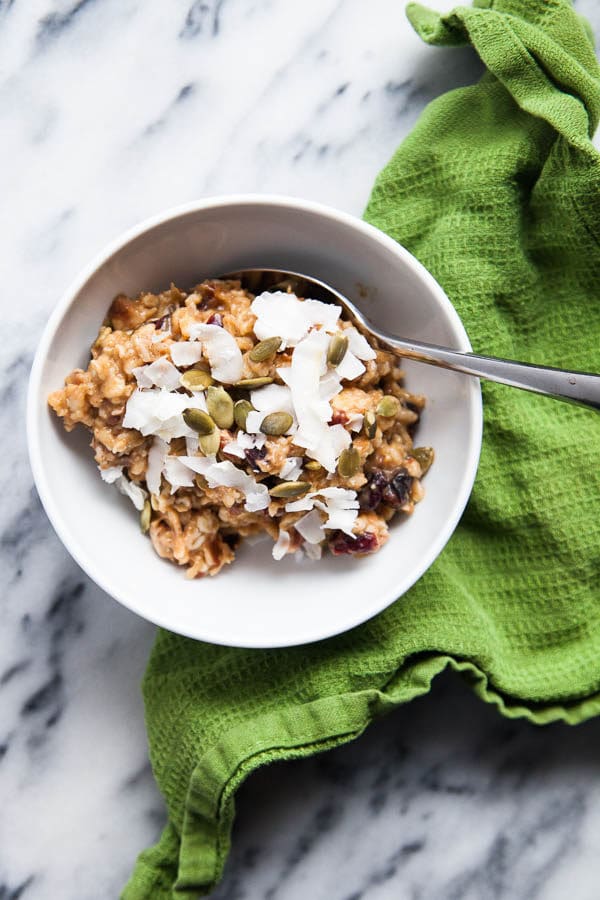 This bubbling pot of warm, creamy Stovetop Oatmeal is an homage to the autumn season with pumpkin puree, dried cranberries, pecans, and warming spices.