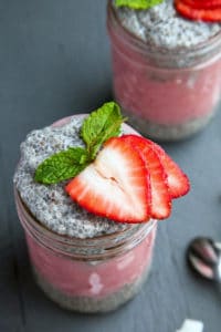 Layers of thick Greek-style Vanilla Chia Pudding are layered with strawberry puree and topped with fresh strawberry slices.
