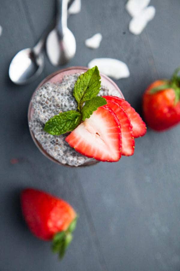 Layers of thick Greek-style Vanilla Chia Pudding are layered with strawberry puree and topped with fresh strawberry slices.