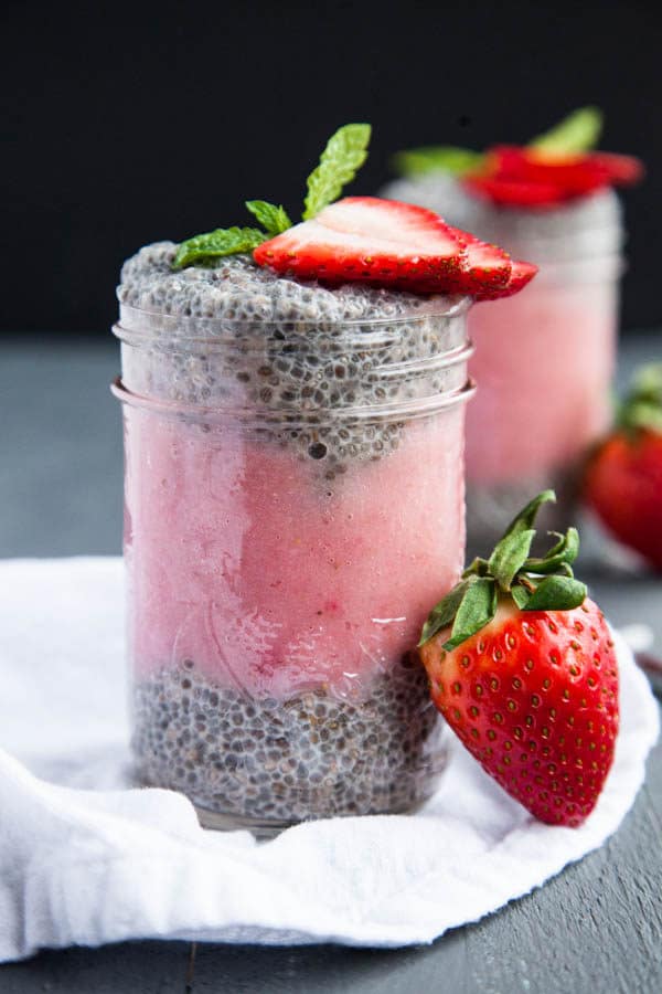 Layers of thick Greek-style Vanilla Chia Pudding are layered with strawberry puree and topped with fresh strawberry slices.