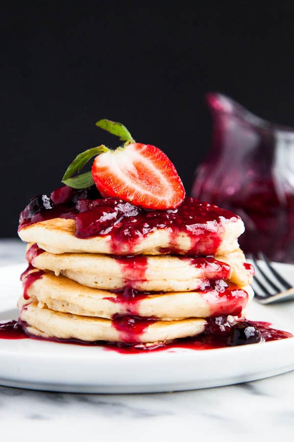 Buttermilk pancakes are light, fluffy, and smothered in a sticky sweet triple berry drizzle. | breakfast for dinner