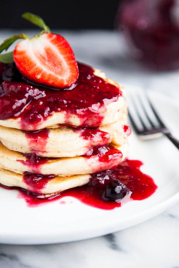 Buttermilk pancakes are light, fluffy, and smothered in a sticky sweet triple berry drizzle. | breakfast for dinner