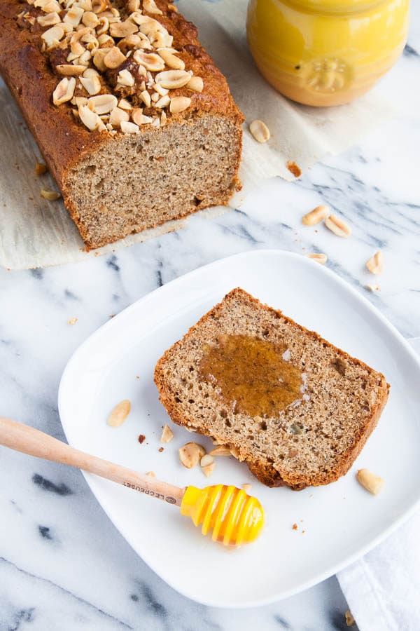 My very favourite 3-banana Banana Bread recipe is thrown together with a big scoop of peanut butter and sprinkled with a crunchy peanut topping. 