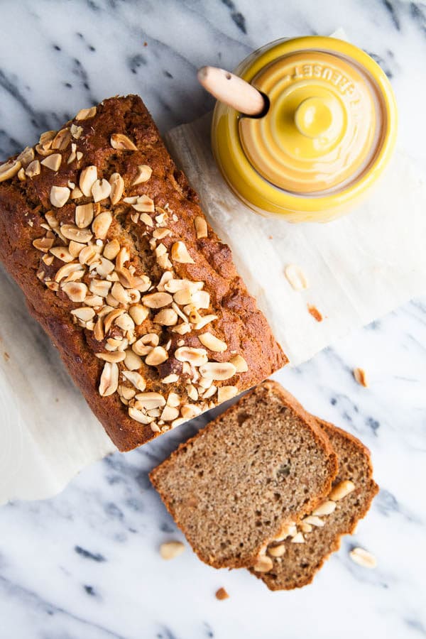 My very favourite moist 3-banana Banana Bread recipe is thrown together with a big scoop of peanut butter and sprinkled with a crunchy peanut topping. 