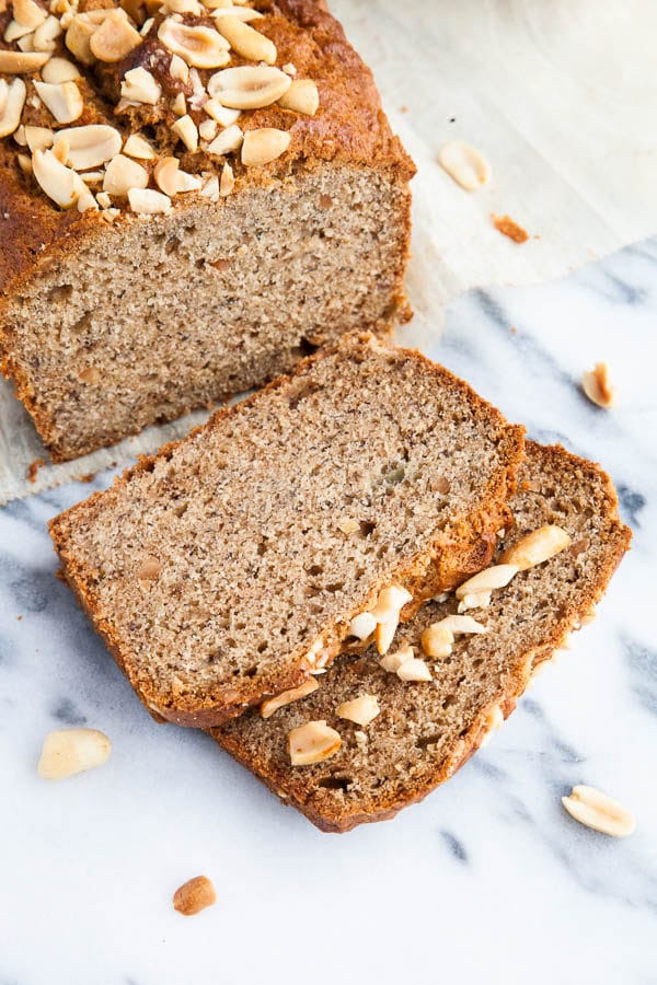 My very favourite moist 3-banana Banana Bread recipe is thrown together with a big scoop of peanut butter and sprinkled with a crunchy peanut topping. 