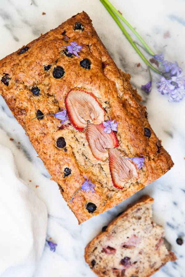 This Berry Banana Bread is kept moist with a secret ingredient and each mouthful is bursting with fresh berries.