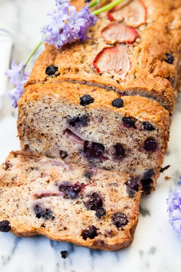 This Berry Banana Bread is kept moist with a secret ingredient and each mouthful is bursting with fresh berries. My family loves this recipe!