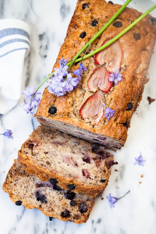 This Berry Banana Bread is kept moist with a secret ingredient and each mouthful is bursting with fresh berries. My family loves this recipe!