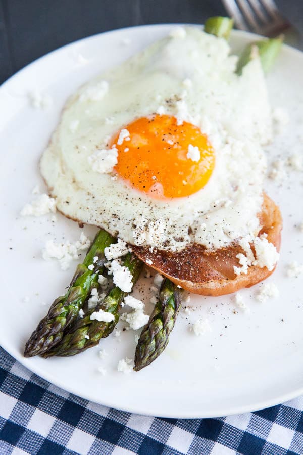 This is a simple sheet pan breakfast celebrating the Spring flavours of fresh asparagus. Roasted asparagus sprigs are stacked with crispy prosciutto, a soft fried egg, and crumbles of creamy goat cheese and it is the perfect combination of roasty, salty, and creamy.