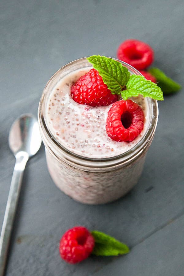 Beautiful pink berries are stirred in with chia seeds and milk to create a simple and nutritious Raspberry Chia Pudding breakfast.