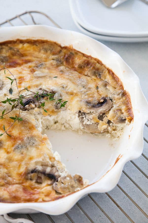 Layers of mushrooms, eggs, and cheese ensure this crustless quiche is fluffy, creamy, savory goodness! Makes an excellent holiday brunch for your guests.