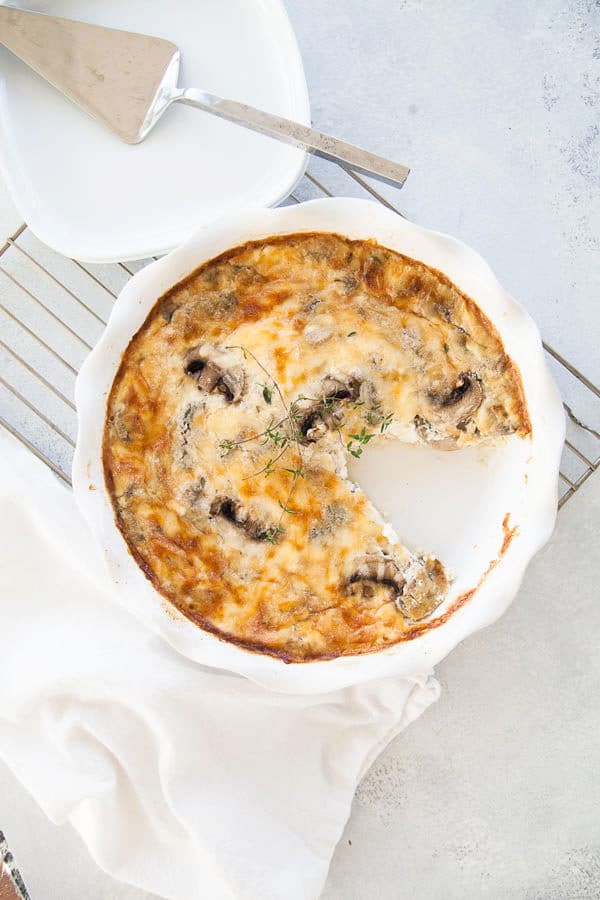 Layers of mushrooms, eggs, and cheese ensure this crustless quiche is fluffy, creamy, savory goodness! Makes an excellent holiday brunch for your guests.