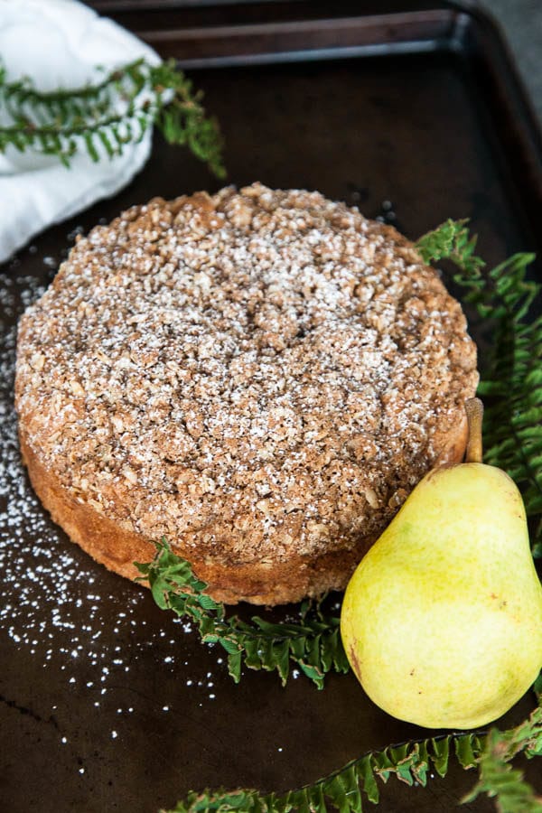 Spiced Pear Crumble Cake is packed with juicy pear, warm cinnamon, and generously sprinkled with a crumbly brown sugar oat topping.