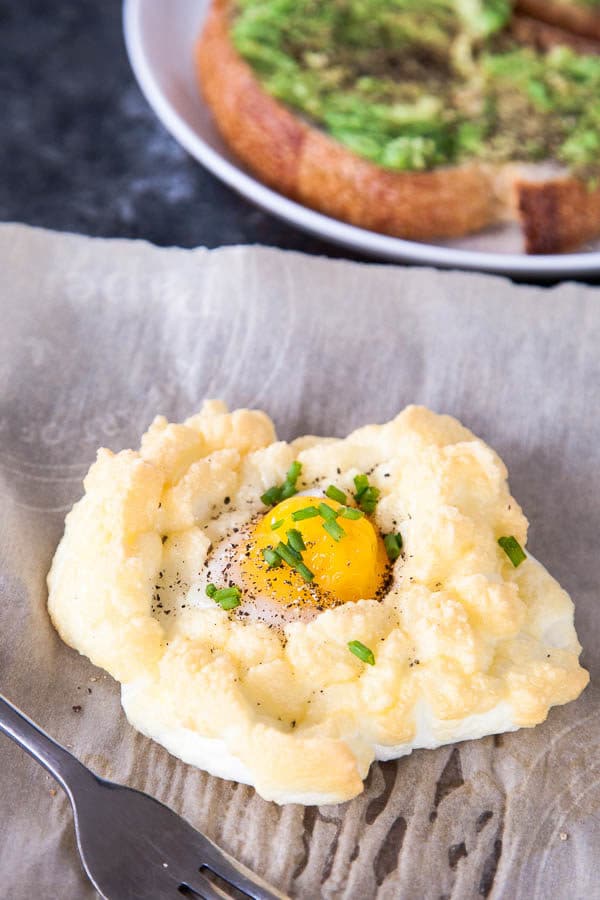 Cloud Eggs are a fun new way to eat eggs for breakfast: you get light, fluffy whites with a perfectly runny yolk. The absolute best of both worlds.