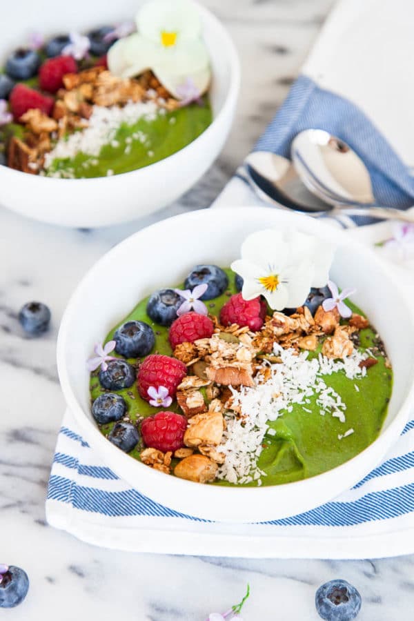 Smoothie bowls are a heartier and more filling breakfast than a smoothie. Load up on toppings - my favourites are homemade granola and shredded coconut. Recipe makes one very large or two smaller smoothie bowls.