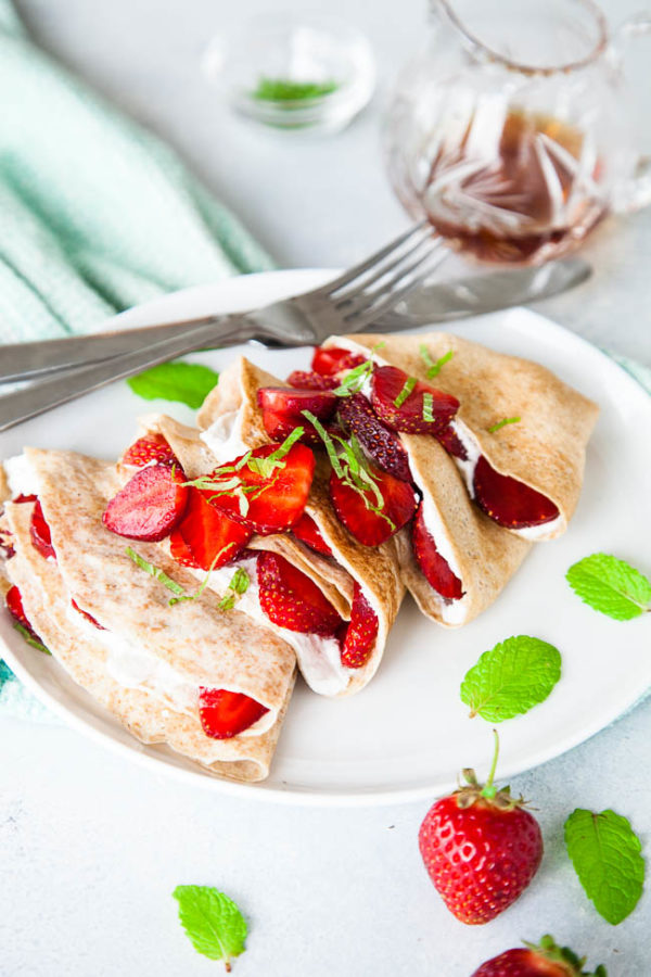 These crepes may look like an indulgent treat, but by using 100% whole wheat flour, fresh fruit, and coconut cream, you can feel good about eating these crepes at any time of day - breakfast or dinner!