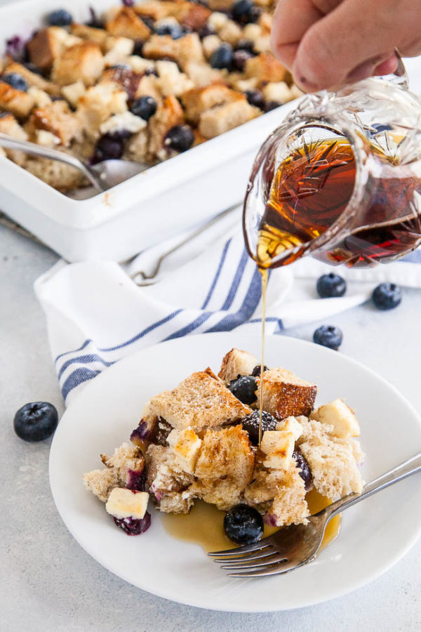 Slightly toasted and top, soft in the middle and each bite bursting with a pocket of fluffy cream cheese and warm exploding blueberries - this french toast bake is perfect for the holidays because you can make it overnight!